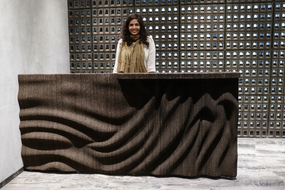 cardboard reception table for nina puri architects